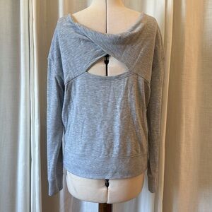 Super soft heather grey fleece inside peekaboo detailing on the back sweatshirt